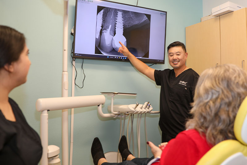 Dr. Park explaining dental implant procedure